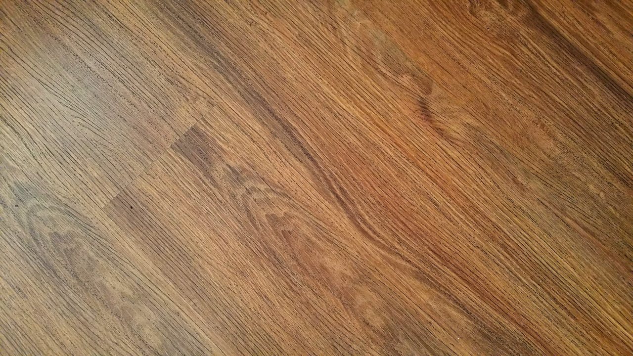 Detailed image of rustic wooden flooring with visible wood grain texture.